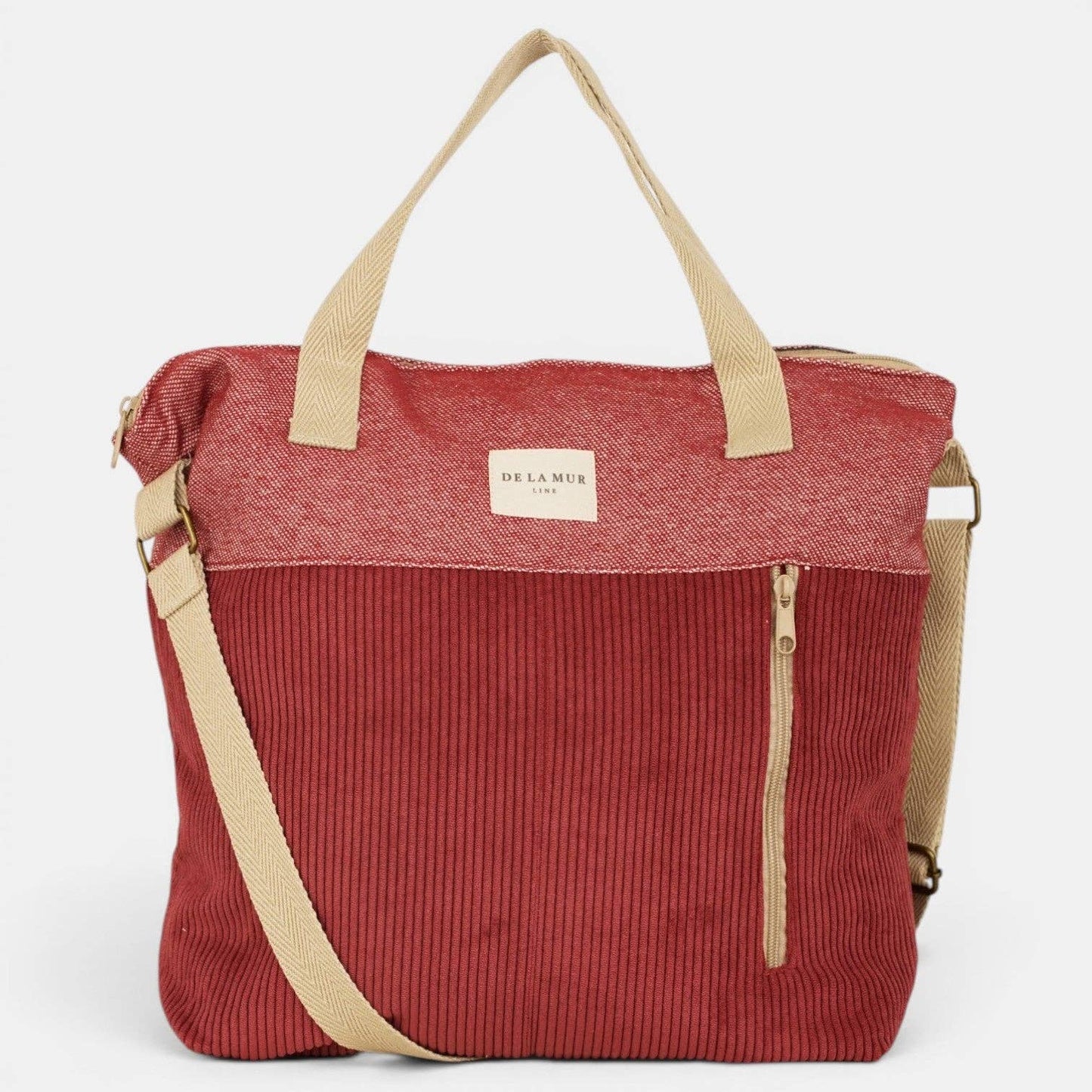 Große bordeauxrote De La Mur Arde Schultertasche aus Cord mit beigen Henkeln, verstellbarem Gurt und Reißverschlusstasche außen.