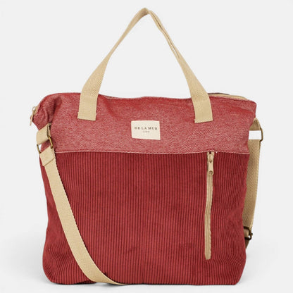 Große bordeauxrote De La Mur Arde Schultertasche aus Cord mit beigen Henkeln, verstellbarem Gurt und Reißverschlusstasche außen.