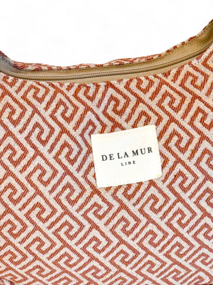 De La Mur Luna Grec Tasche mit geometrischem Muster, Markenlogo sichtbar