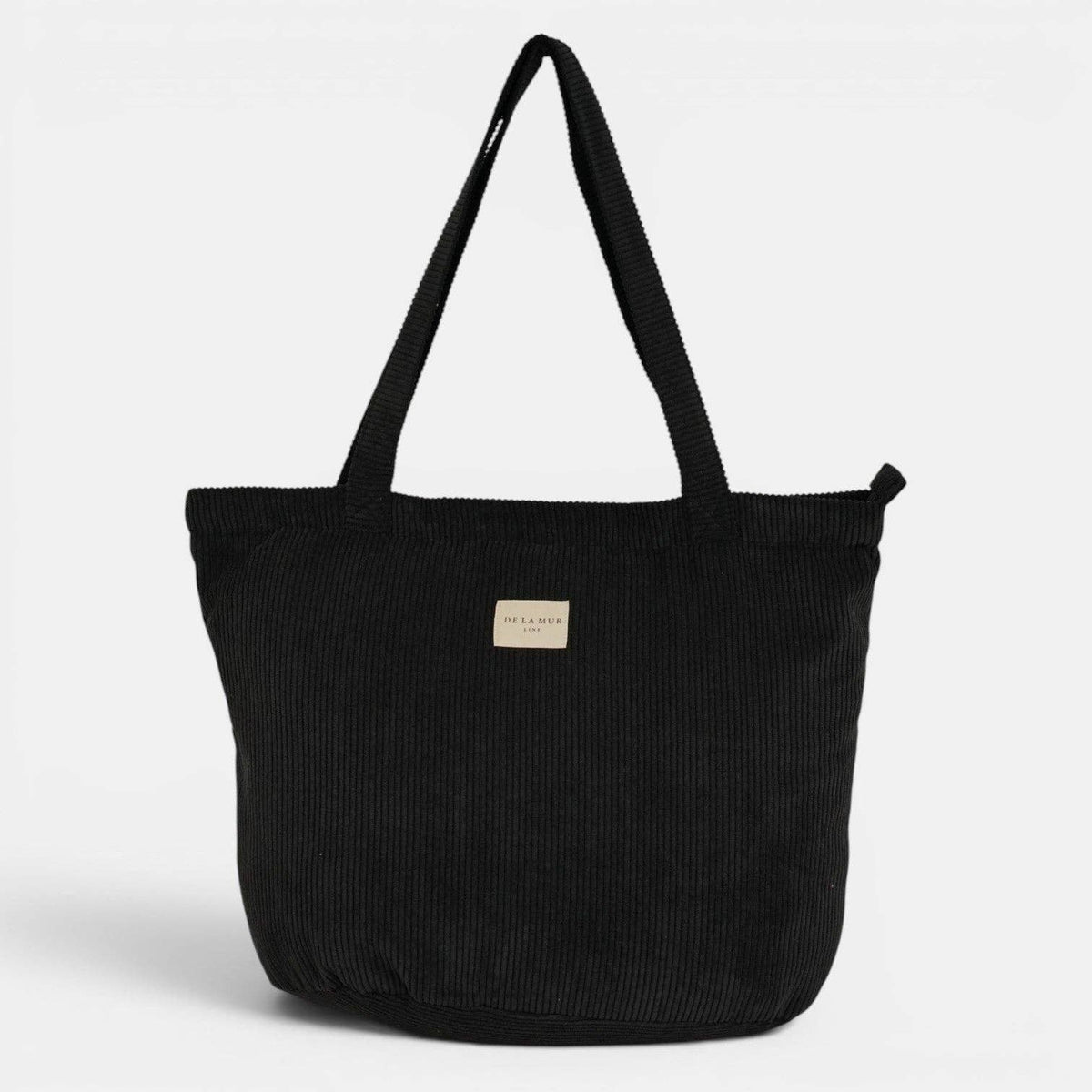 Große Shopper-Tasche Nit von De La Mur aus schwarzem Cord mit langen Schultergriffen
