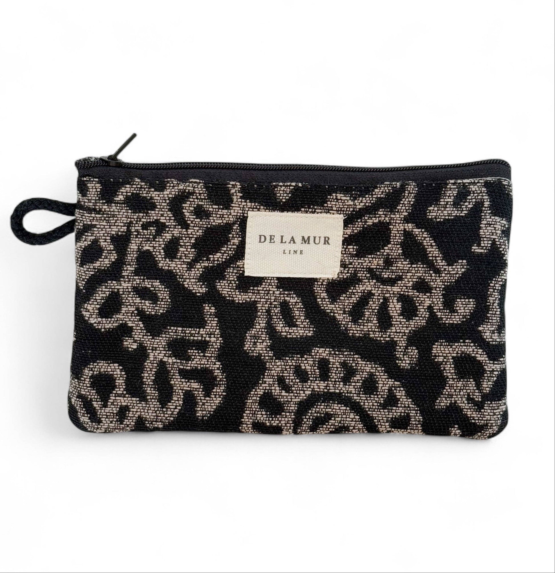 De La Mur Teide Mini-Kosmetiktasche mit beigem Blumenmuster auf Schwarz